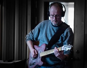 Guitarist Peter Enström records his electric guitar in the studio