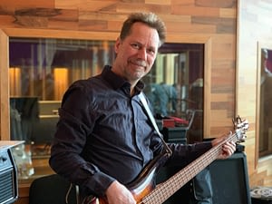 Bass player Thomas Midemyr recording electric bass