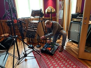 Guitarist Peter Enström prepares his guitar rig for recording